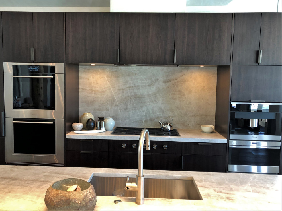 Open concept kitchen - large contemporary galley medium tone wood floor, brown floor and vaulted ceiling open concept kitchen idea in Other with an undermount sink, flat-panel cabinets, dark wood cabinets, colored appliances, an island and multicolored countertops