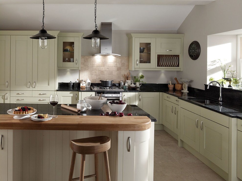 Design ideas for a country kitchen in Surrey with beige cabinets, granite worktops and an island.