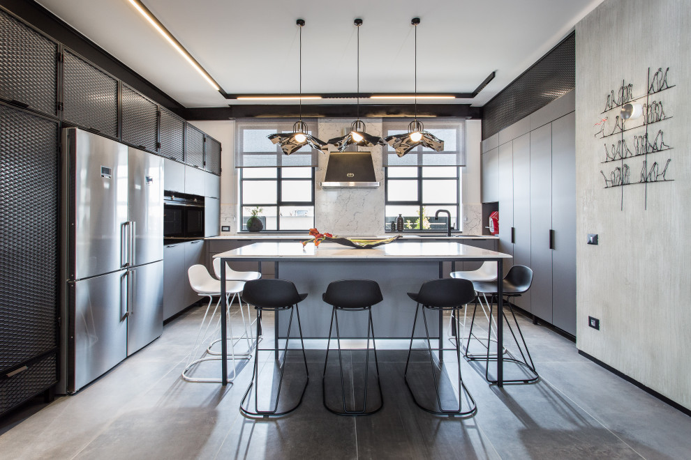 Mid-sized urban u-shaped porcelain tile and gray floor open concept kitchen photo in Tel Aviv with an undermount sink, flat-panel cabinets, gray cabinets, quartzite countertops, white backsplash, porcelain backsplash, stainless steel appliances, an island and white countertops