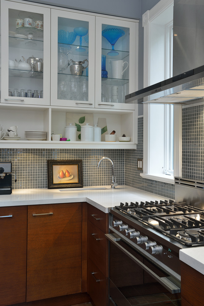 Inspiration for a contemporary kitchen in Toronto with glass-front cabinets, white cabinets and grey splashback.