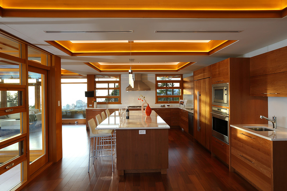 This is an example of a large contemporary kitchen/diner in Vancouver with an island.