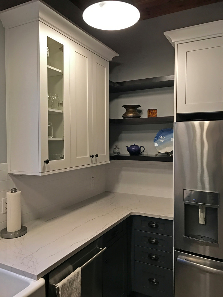 Mid-sized cottage single-wall vinyl floor eat-in kitchen photo in Seattle with a farmhouse sink, shaker cabinets, white cabinets, quartzite countertops, white backsplash, subway tile backsplash, stainless steel appliances and no island