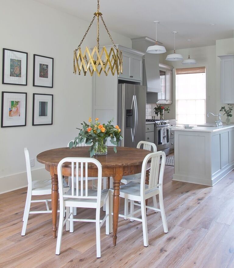 Eat-in kitchen - mid-sized country galley light wood floor eat-in kitchen idea in Atlanta with a farmhouse sink, shaker cabinets, gray cabinets, marble countertops, white backsplash, ceramic backsplash, stainless steel appliances and no island