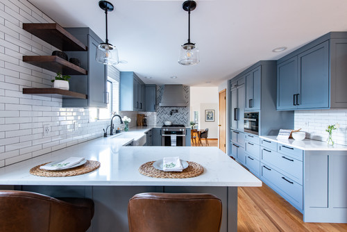 Upper white cabinets with lower navy blue for timeless kitchen design