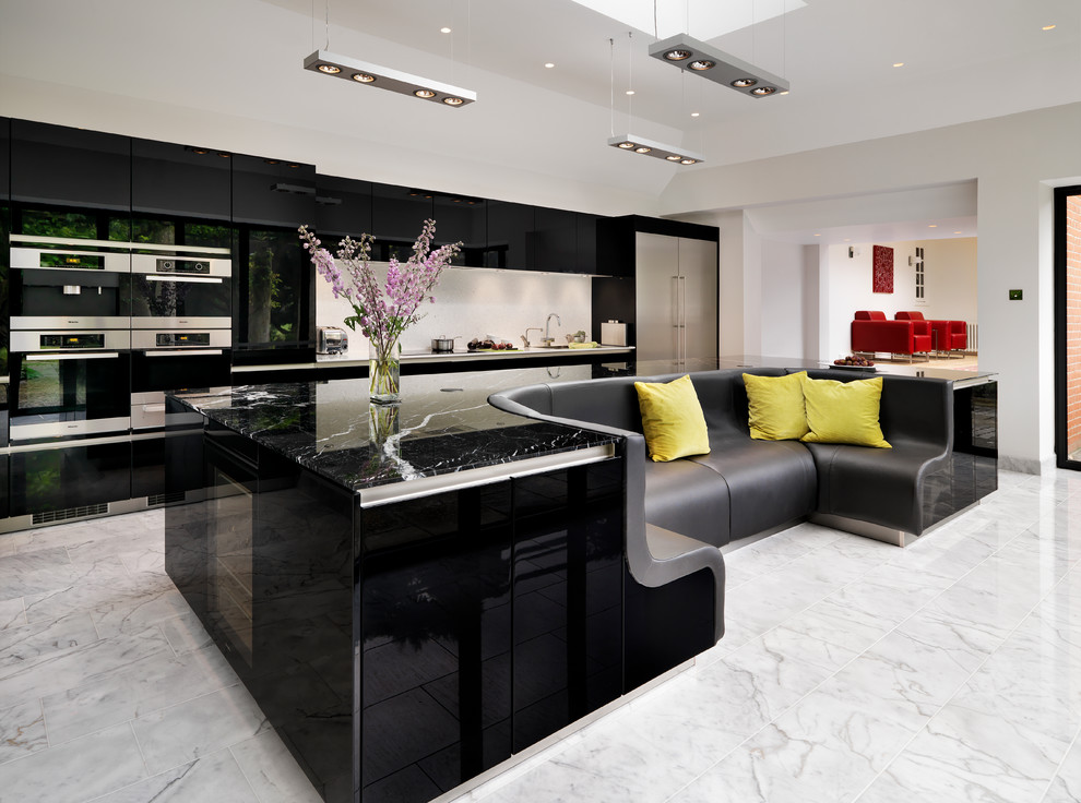 Design ideas for a contemporary kitchen in Hampshire with flat-panel cabinets, black cabinets and stainless steel appliances.