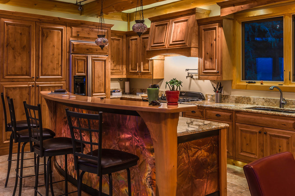 Large arts and crafts u-shaped marble floor eat-in kitchen photo in Dallas with an undermount sink, raised-panel cabinets, medium tone wood cabinets, marble countertops, beige backsplash, stone slab backsplash, paneled appliances and an island