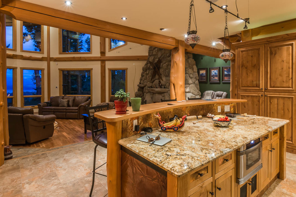 Inspiration for a large craftsman u-shaped marble floor eat-in kitchen remodel in Dallas with an undermount sink, raised-panel cabinets, medium tone wood cabinets, marble countertops, beige backsplash, stone slab backsplash, paneled appliances and an island