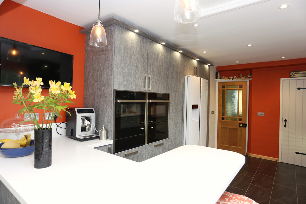 Design ideas for a medium sized contemporary galley enclosed kitchen in Other with flat-panel cabinets, grey cabinets, composite countertops, white splashback, no island and white worktops.