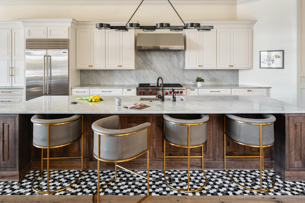 Eat-in kitchen - transitional galley multicolored floor eat-in kitchen idea in Tampa with an undermount sink, raised-panel cabinets, white cabinets, gray backsplash, stainless steel appliances, an island and gray countertops