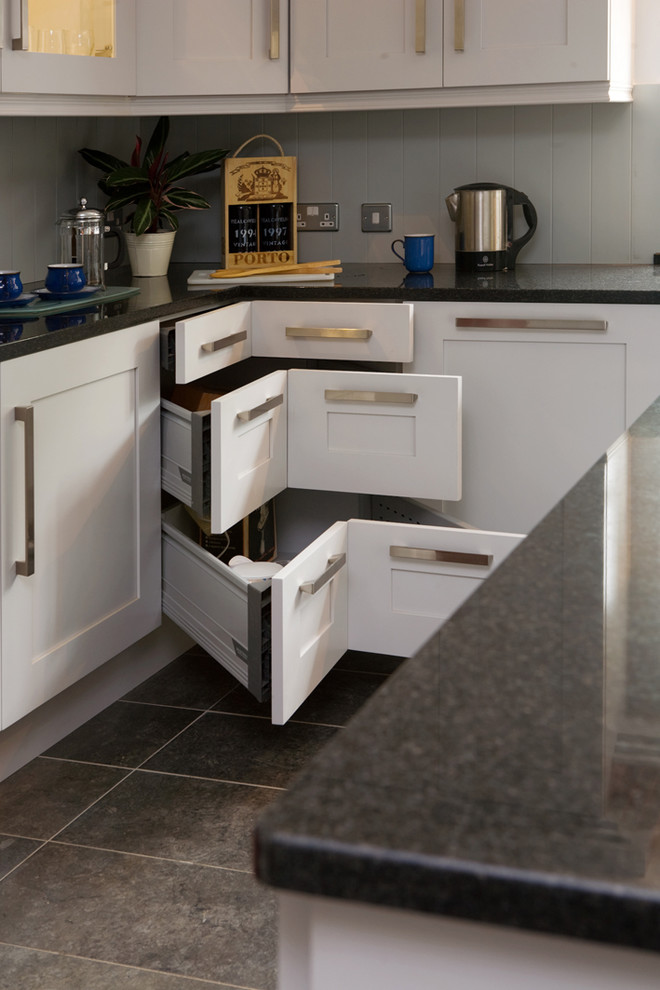 Kitchen - transitional kitchen idea in Other with shaker cabinets, white cabinets and black countertops