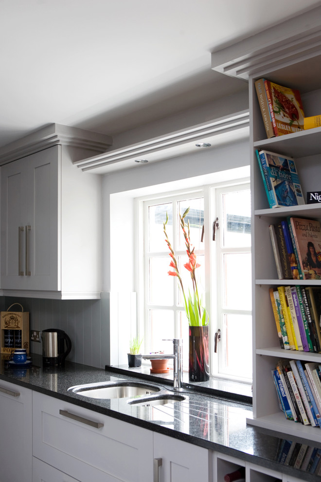 Inspiration for a traditional kitchen in Other with a double-bowl sink, shaker cabinets, white cabinets and white splashback.