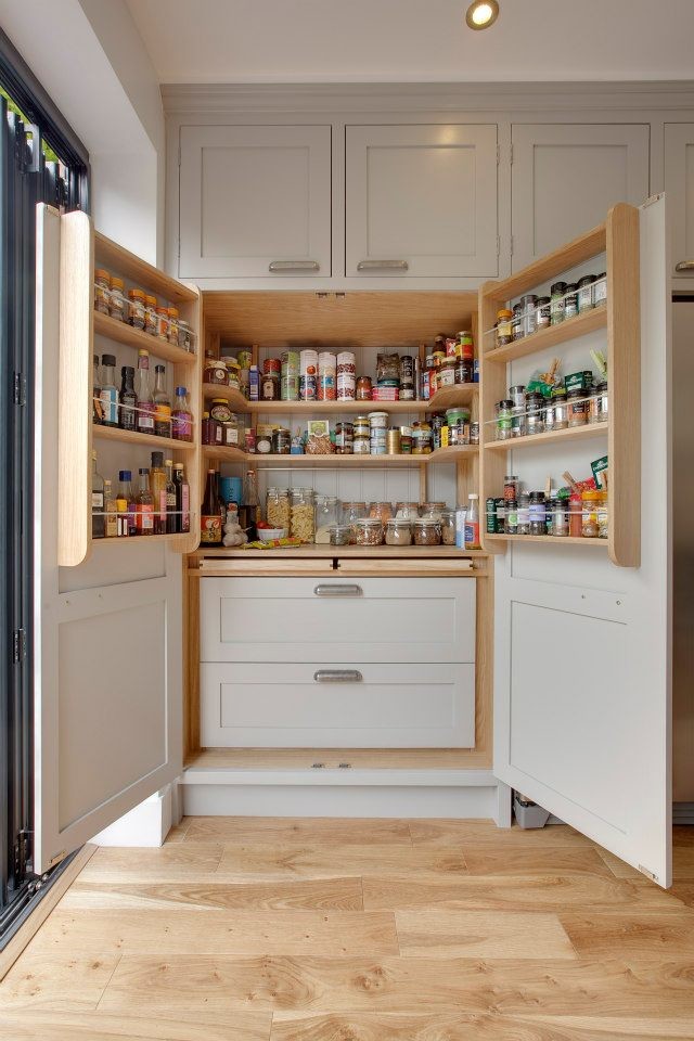 Large elegant u-shaped light wood floor enclosed kitchen photo in DC Metro with an undermount sink, shaker cabinets, gray cabinets and quartz countertops