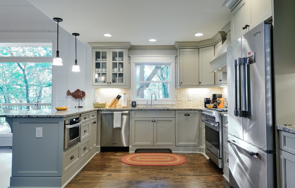 Inspiration for a traditional u-shaped kitchen in Atlanta with recessed-panel cabinets, grey cabinets, beige splashback and stainless steel appliances.