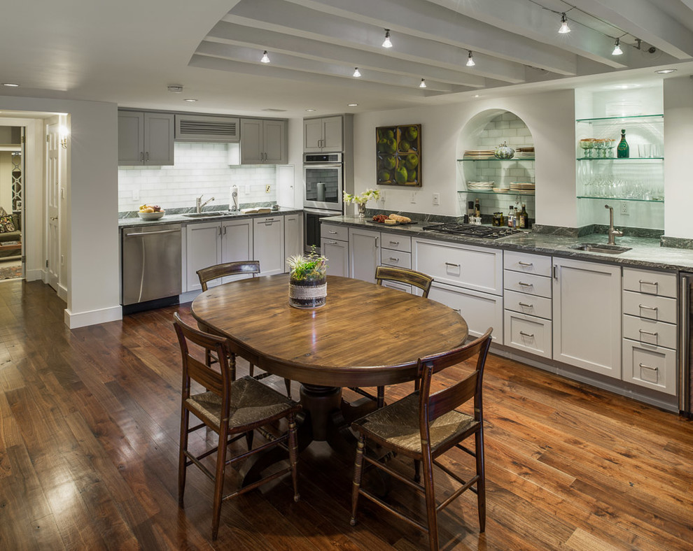 Example of a large transitional l-shaped dark wood floor eat-in kitchen design in Boston with an undermount sink, shaker cabinets, white cabinets, onyx countertops, stone slab backsplash, stainless steel appliances and no island