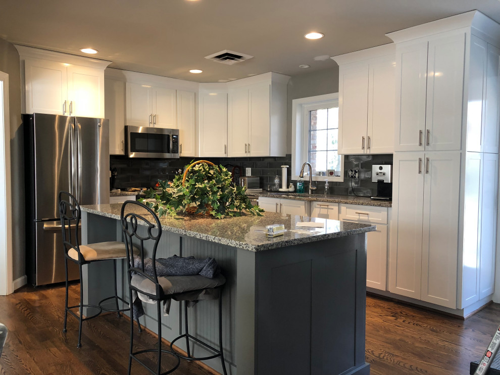 Eat-in kitchen - modern l-shaped eat-in kitchen idea in Richmond with shaker cabinets, white cabinets, granite countertops, an island and gray countertops