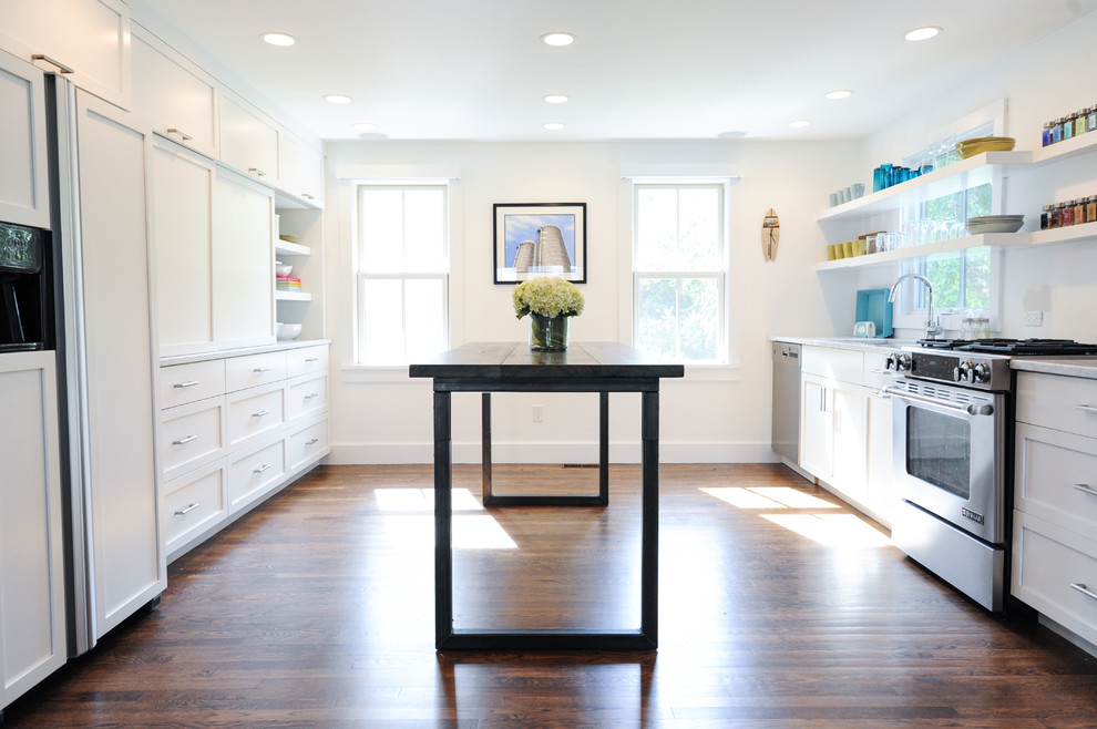 Transitional dark wood floor eat-in kitchen photo in Boston with an undermount sink, shaker cabinets, white cabinets, marble countertops, white backsplash, stainless steel appliances and an island