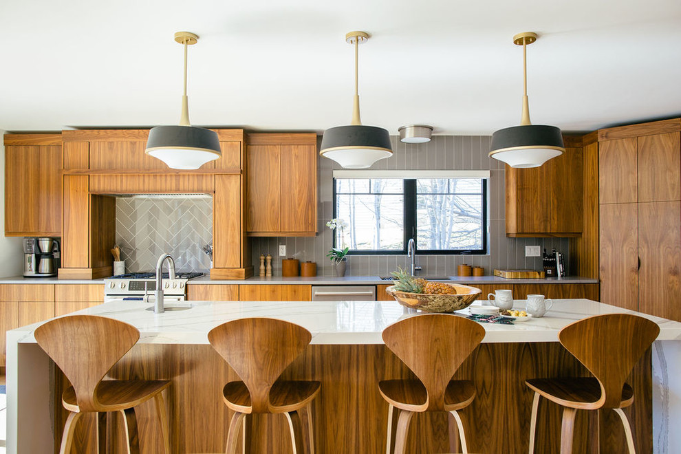 Kitchen - mid-century modern l-shaped kitchen idea in Other with an undermount sink, flat-panel cabinets, medium tone wood cabinets, gray backsplash, an island and white countertops