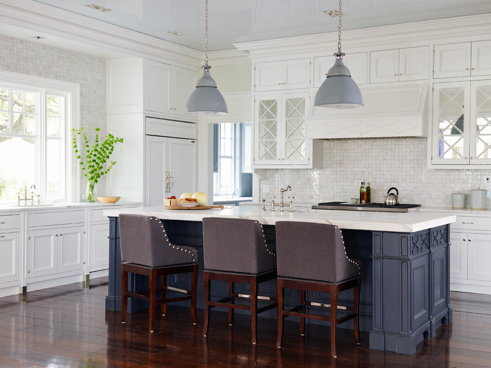 Inspiration for a large coastal dark wood floor kitchen remodel in Jacksonville with recessed-panel cabinets, white cabinets, beige backsplash, mosaic tile backsplash, paneled appliances and an island