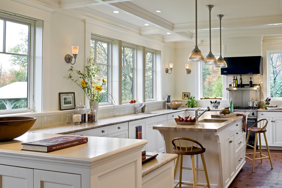 Inspiration for a victorian kitchen remodel in Burlington with wood countertops, recessed-panel cabinets, white cabinets and stainless steel appliances