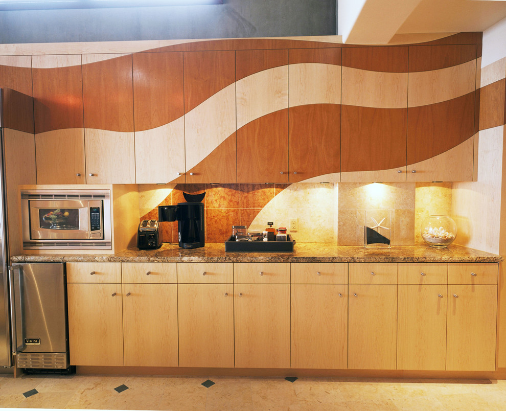Example of a huge minimalist l-shaped limestone floor eat-in kitchen design in San Francisco with a double-bowl sink, flat-panel cabinets, light wood cabinets, granite countertops, beige backsplash, ceramic backsplash, stainless steel appliances and an island