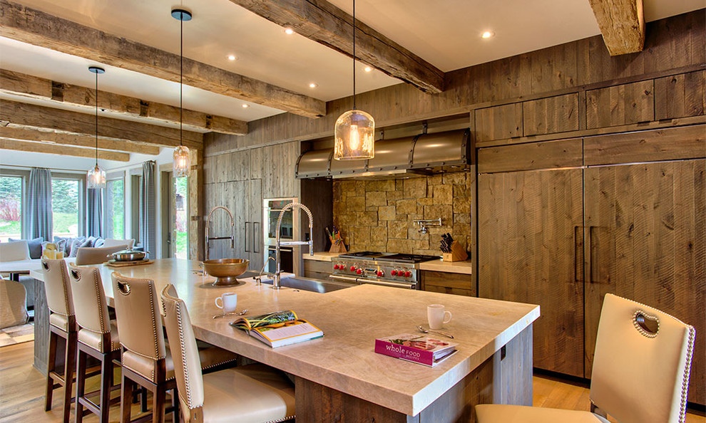 This is an example of a rustic open plan kitchen in Other with flat-panel cabinets, dark wood cabinets, integrated appliances and an island.