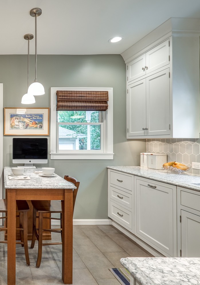 Inspiration for a small classic l-shaped enclosed kitchen in Other with a single-bowl sink, beaded cabinets, white cabinets, engineered stone countertops, white splashback, ceramic splashback, stainless steel appliances, porcelain flooring and an island.