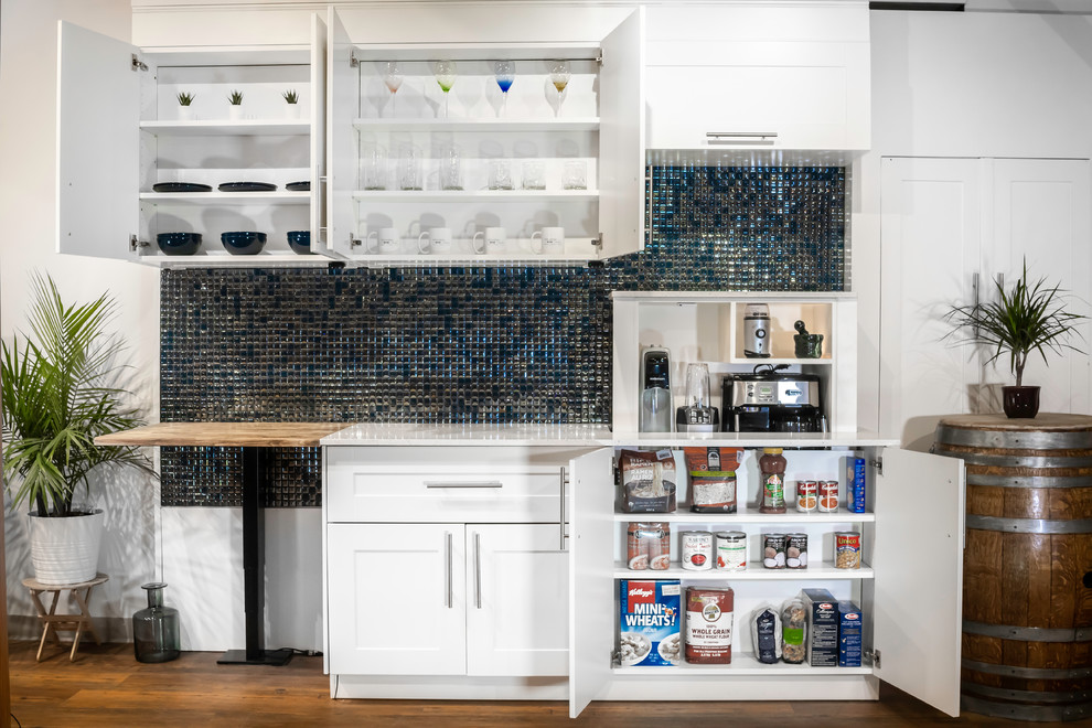 Inspiration for a modern kitchen pantry remodel in Vancouver with shaker cabinets, quartz countertops and blue backsplash