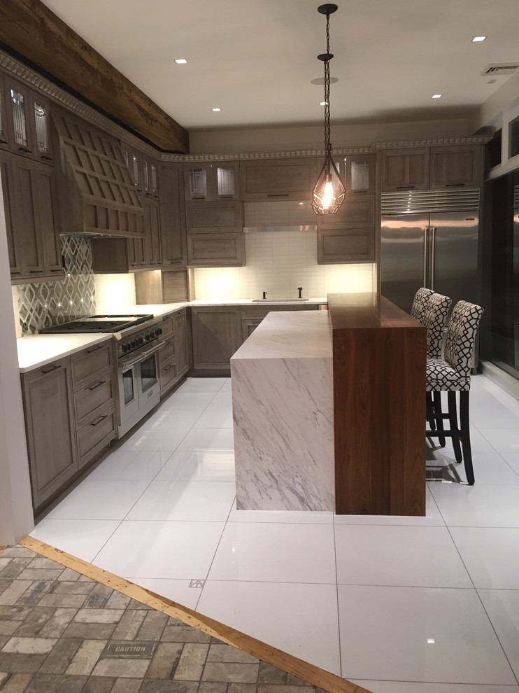 Photo of an expansive modern l-shaped kitchen/diner in Bridgeport with a single-bowl sink, flat-panel cabinets, grey cabinets, marble worktops, white splashback, ceramic splashback, stainless steel appliances, porcelain flooring, an island, white floors and white worktops.