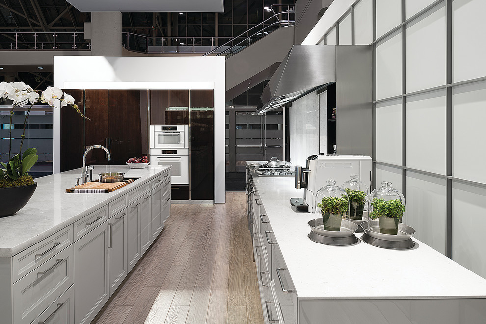 Design ideas for a contemporary kitchen/diner in San Diego with recessed-panel cabinets, white cabinets and white appliances.