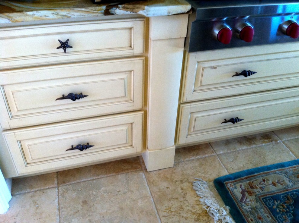 Nautical kitchen in Grand Rapids with distressed cabinets.
