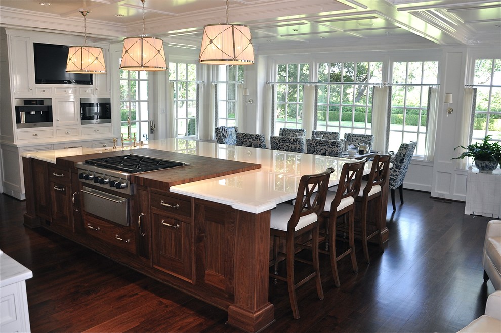 Inspiration for a large timeless l-shaped dark wood floor eat-in kitchen remodel in Dallas with shaker cabinets, white cabinets, marble countertops, stainless steel appliances, an island and an undermount sink