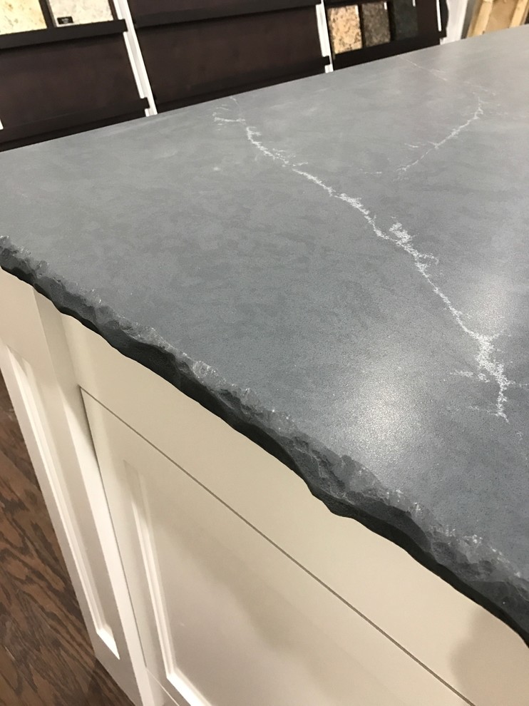 Inspiration for a mid-sized rustic dark wood floor and brown floor kitchen remodel in Atlanta with shaker cabinets, white cabinets, quartz countertops and an island