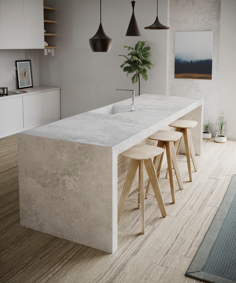 Example of an urban eat-in kitchen design in Hampshire with beige cabinets, quartzite countertops, an island and beige countertops