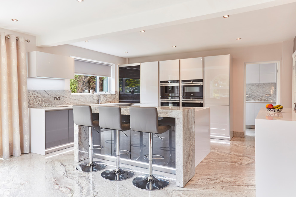 Inspiration for a medium sized contemporary u-shaped kitchen/diner in Other with flat-panel cabinets, white cabinets, grey splashback, stone slab splashback, black appliances, an island, grey floors, an integrated sink, quartz worktops, marble flooring, white worktops and a coffered ceiling.