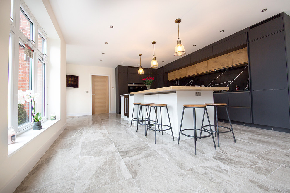Inspiration for a huge contemporary limestone floor and gray floor eat-in kitchen remodel in Other with an island