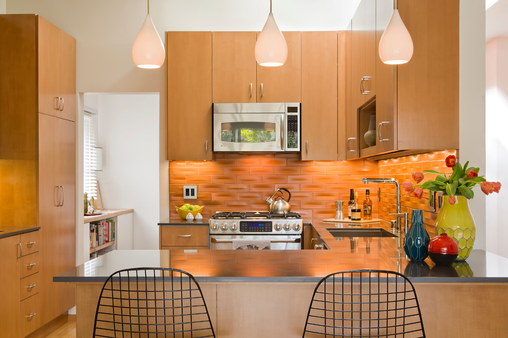 Mid-sized 1950s l-shaped light wood floor open concept kitchen photo in Los Angeles with a drop-in sink, flat-panel cabinets, light wood cabinets, orange backsplash, stainless steel appliances and no island