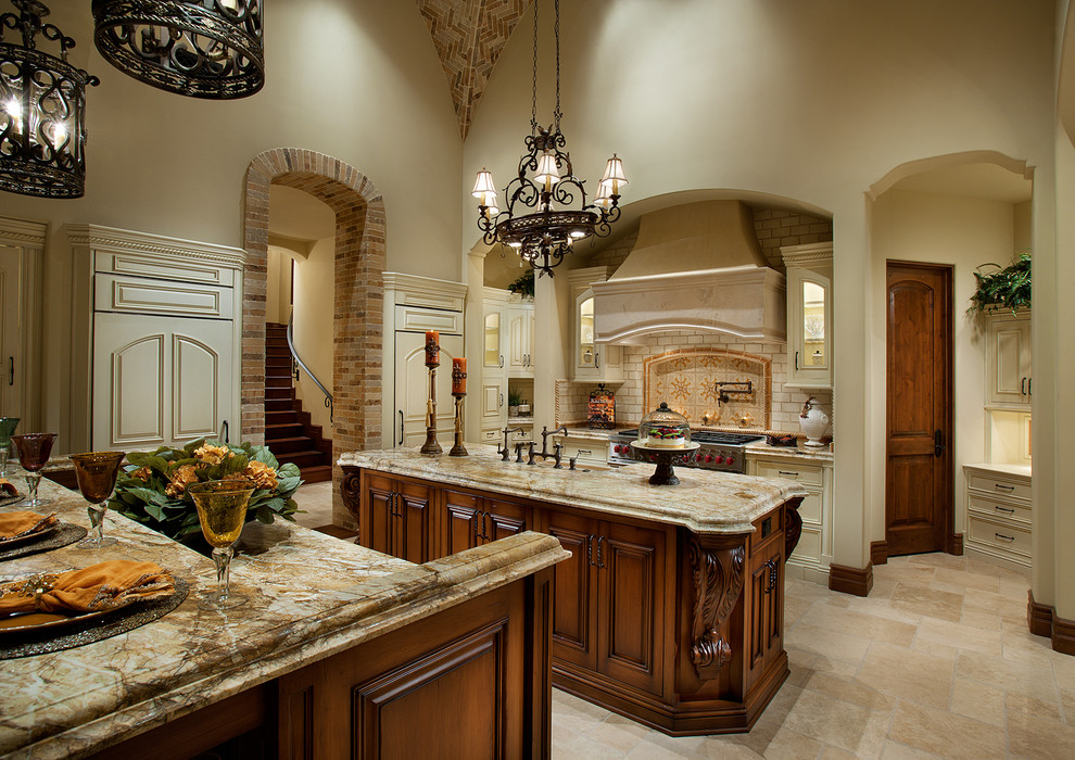 Enclosed kitchen - huge u-shaped travertine floor and multicolored floor enclosed kitchen idea in Phoenix with a farmhouse sink, raised-panel cabinets, dark wood cabinets, quartzite countertops, multicolored backsplash, subway tile backsplash, paneled appliances, two islands and multicolored countertops