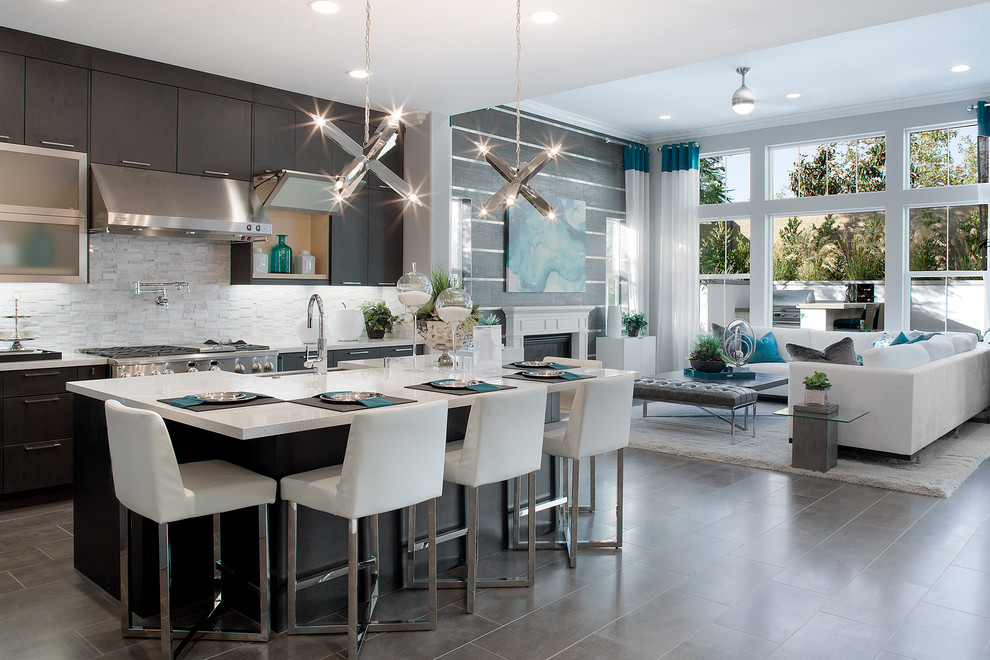 Design ideas for a contemporary kitchen in Orange County with a belfast sink, flat-panel cabinets, dark wood cabinets, stainless steel appliances and an island.