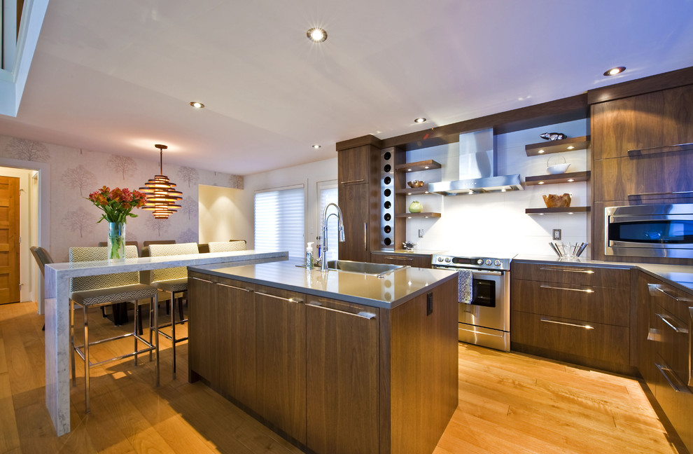 Contemporary kitchen in Calgary with stainless steel appliances.