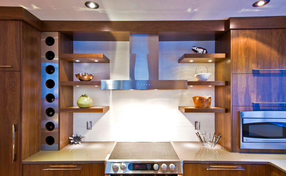 This is an example of a contemporary kitchen in Calgary with stainless steel appliances.