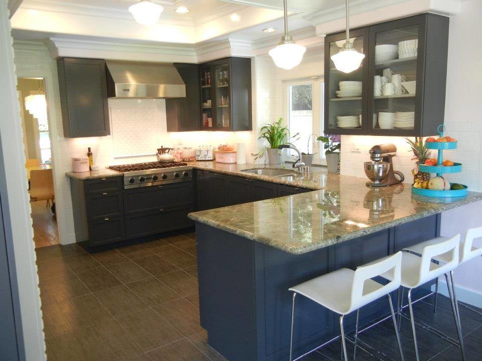 Example of a mid-sized eclectic u-shaped porcelain tile enclosed kitchen design in Los Angeles with an undermount sink, shaker cabinets, gray cabinets, granite countertops, white backsplash, ceramic backsplash, stainless steel appliances and a peninsula
