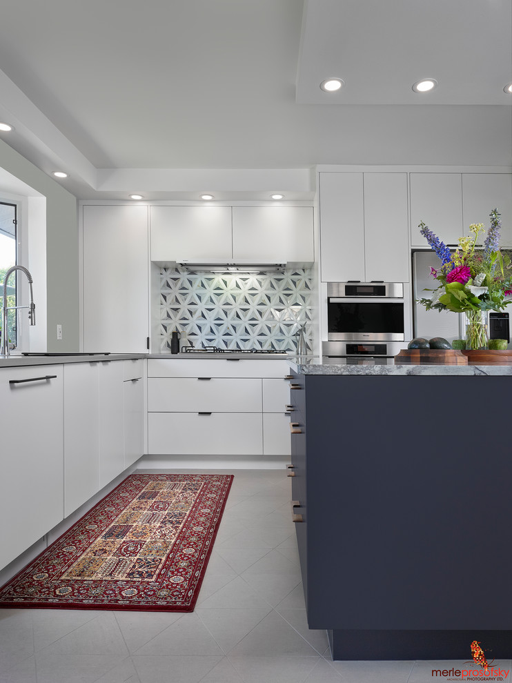 Small danish l-shaped ceramic tile and gray floor open concept kitchen photo in Edmonton with an undermount sink, flat-panel cabinets, blue cabinets, quartzite countertops, multicolored backsplash, marble backsplash, stainless steel appliances, an island and gray countertops