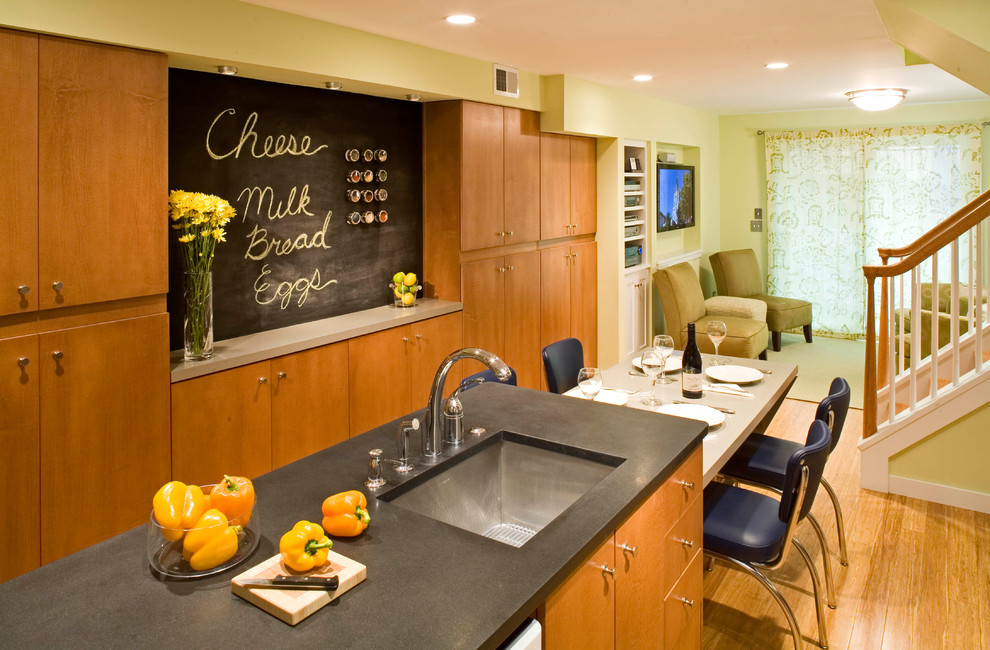 Example of a trendy kitchen design in DC Metro with flat-panel cabinets and medium tone wood cabinets