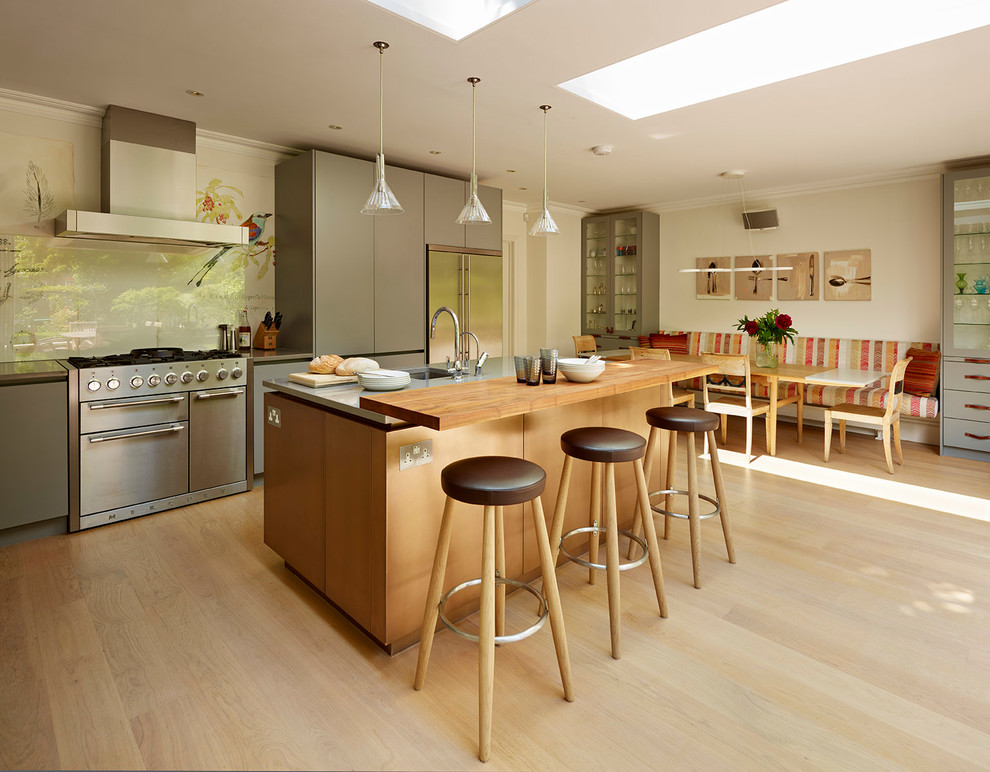 Inspiration for a large contemporary l-shaped light wood floor and beige floor eat-in kitchen remodel in London with an integrated sink, gray cabinets, quartzite countertops, beige backsplash, glass sheet backsplash, stainless steel appliances, an island and gray countertops