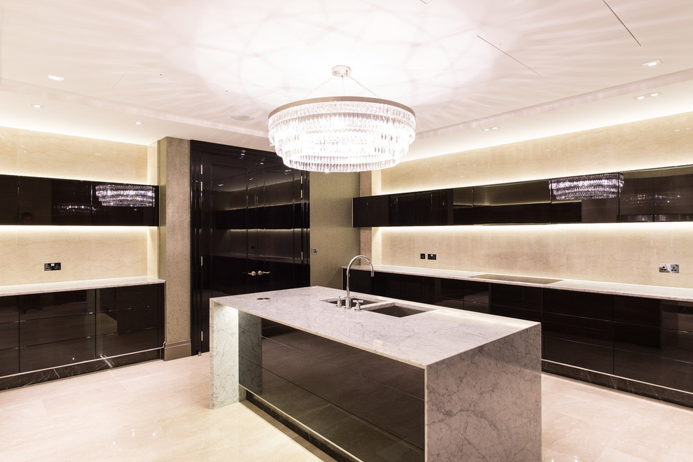 Inspiration for an expansive contemporary l-shaped enclosed kitchen in London with a single-bowl sink, flat-panel cabinets, black cabinets, marble worktops, beige splashback, an island and marble splashback.