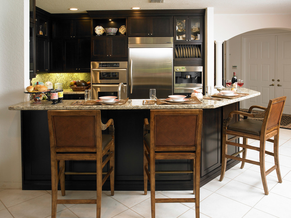 Small Kitchen Remodel Featuring Black Custom Cabinets and Granite ...