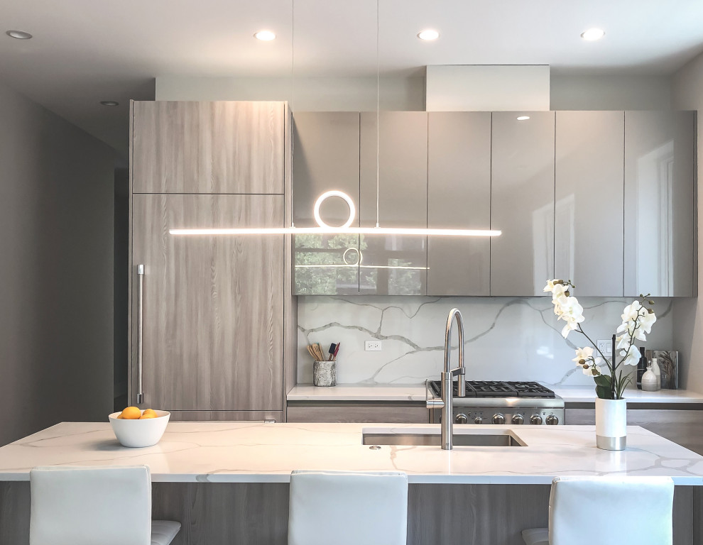 Small contemporary galley open plan kitchen in Chicago with a submerged sink, flat-panel cabinets, medium wood cabinets, engineered stone countertops, grey splashback, stone slab splashback, integrated appliances, medium hardwood flooring, an island, grey floors and white worktops.