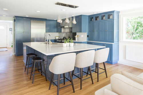 Blue RTA Cabinet Colors with white countertops create visual balance and openness in a modern kitchen design