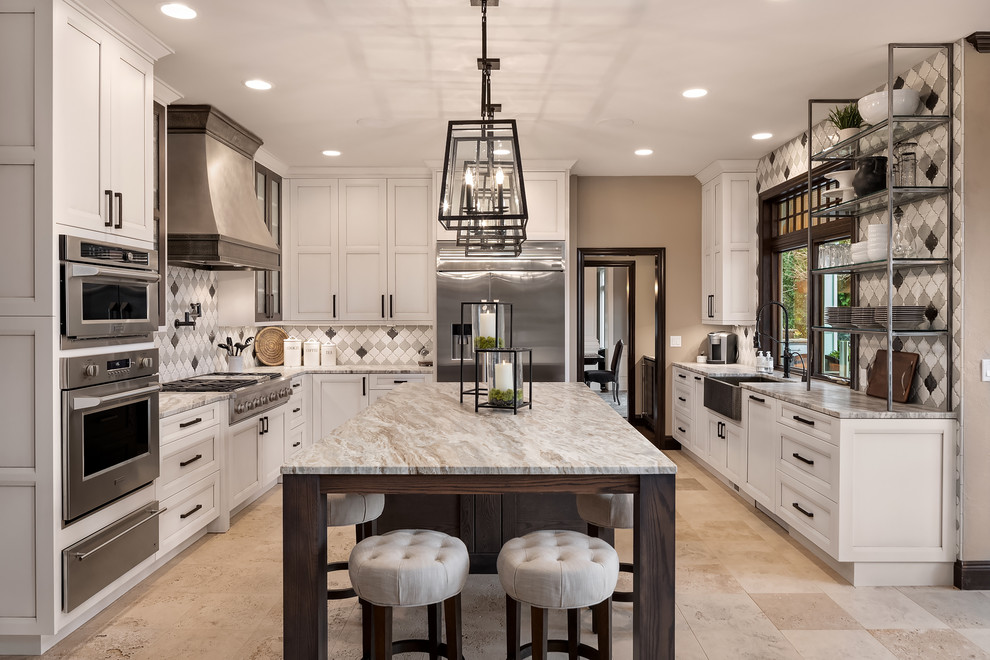 Inspiration for a transitional beige floor enclosed kitchen remodel in Seattle with a farmhouse sink, recessed-panel cabinets, white cabinets, multicolored backsplash, stainless steel appliances, an island and gray countertops