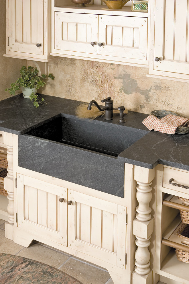 This is an example of a contemporary grey and cream kitchen in Phoenix.